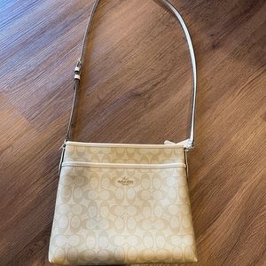 Authentic COACH leather crossbody in cream sig. C and white. Used crossbody.